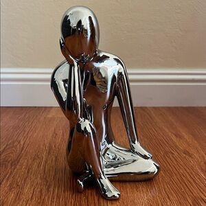 Contemplative Silver Human Sculpture